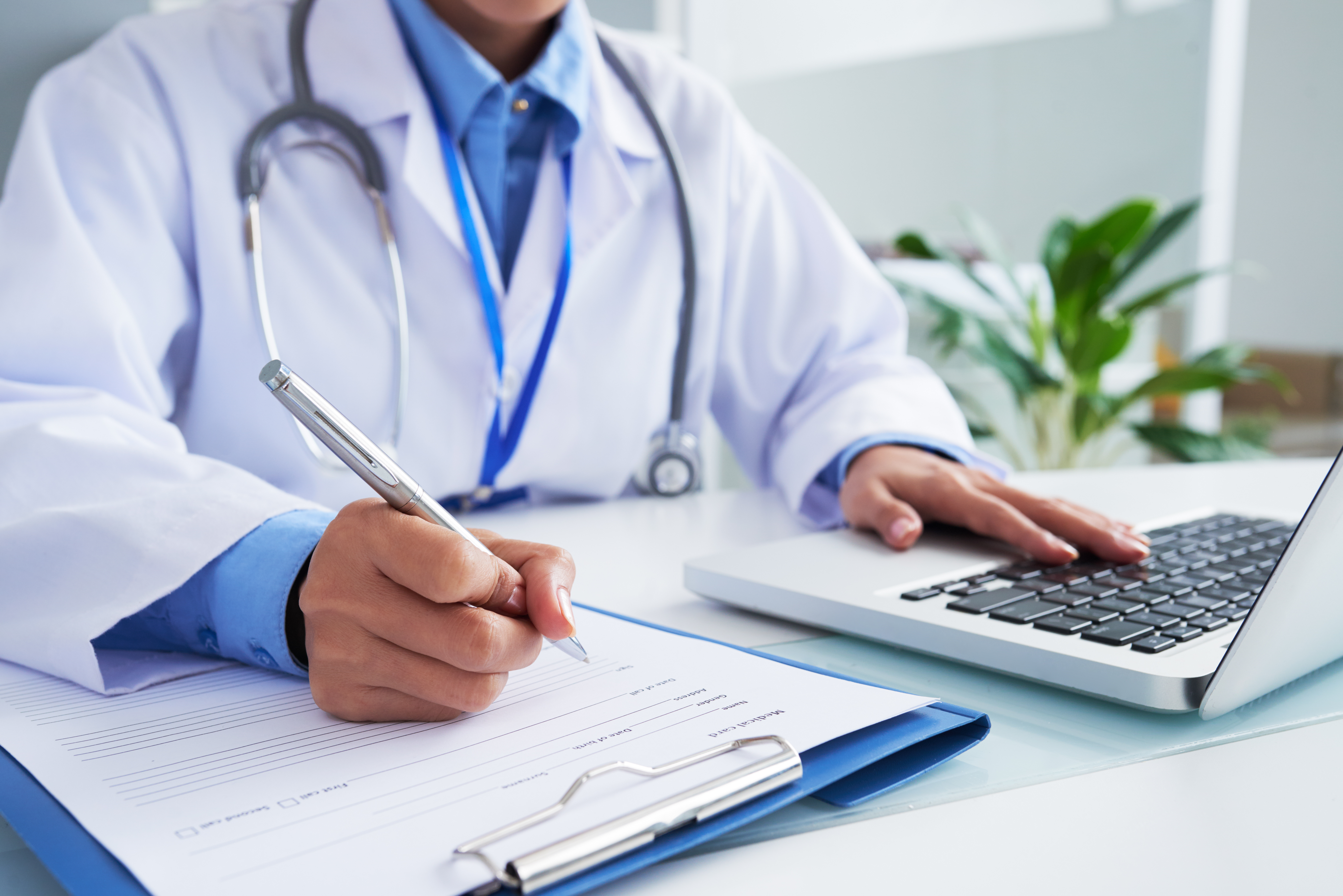 Medical person sitting at desk
